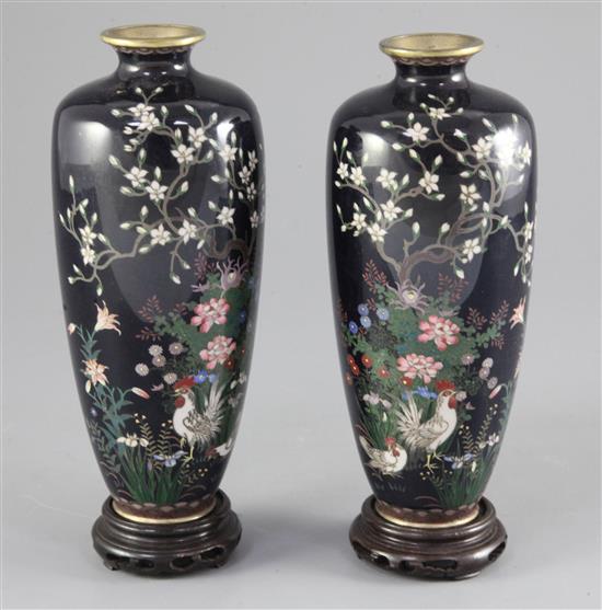 A pair of Japanese silver wire cloisonne enamel ovoid vases, Meiji period, 17.5cm, wood stands, fine cracks to one vase